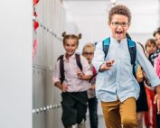Elementary school kids running down hallway