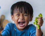 Young child showing signs of anger and stress