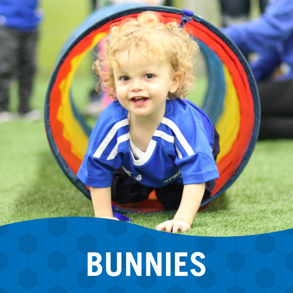 Small child plays during Lil' Kickers Bunnies class