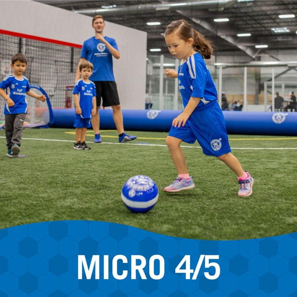 Girl plays soccer during Lil' Kickers Micro 4/5 class