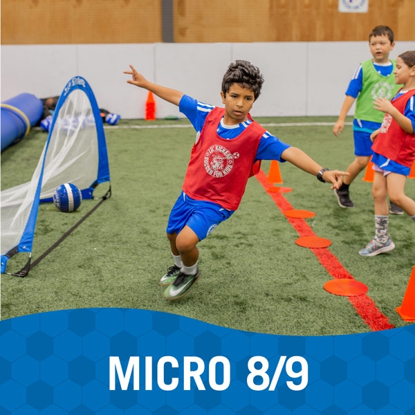 Boy celebrates making a goal during Lil' Kickers Micro 8/9 class
