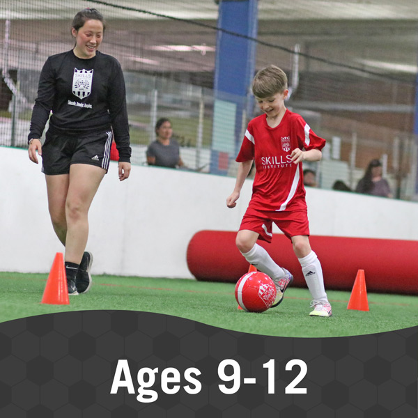 Boy and instructor work on a soccer drill during Skills Institute 9-12 class