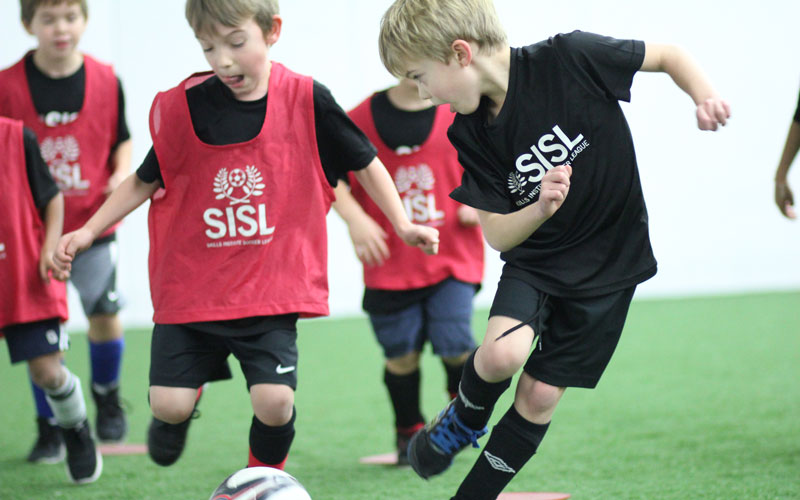 Skills Institute Soccer League players in game