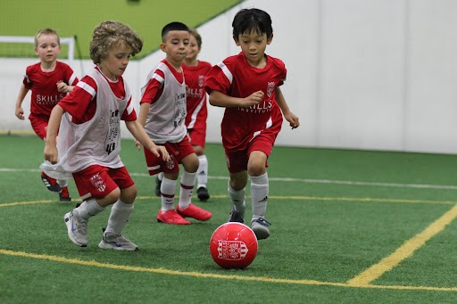 Skills Institute Soccer League players in game